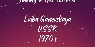 SMILING AT HER TORTURER