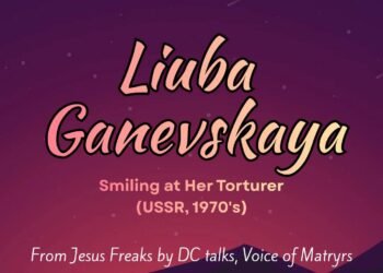 SMILING AT HER TORTURER